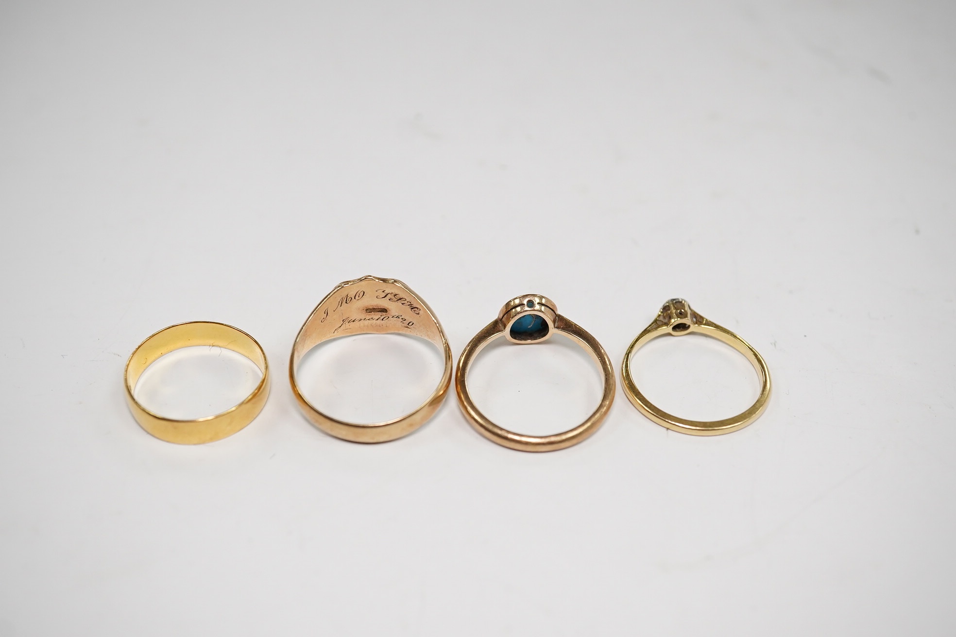 A 22ct gold wedding band, 2.6 grams, a yellow metal and solitaire diamond set ring and two 9ct gold rings including a signet ring, gross weight 9.3 grams. Condition - poor to fair